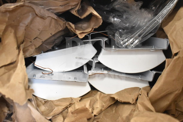 67 Loeb Electric lighting fixtures, packed in paper. Metal and white finish, new condition, wiring visible. Auction lot.