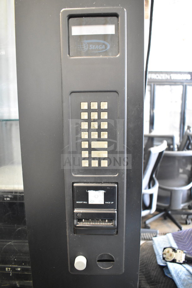 Seaga Commercial Floor Style Vending Machine featuring keypad selection, bill acceptor, good condition. Seaga logo visible.