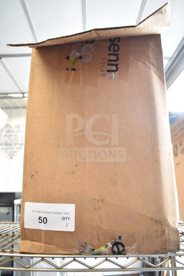 Brown box labeled Sennco Solutions Wave 3 WMT FRAG KIT, visible wear, auction tag indicating quantity 1.
