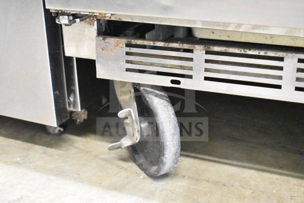 Beverage Air UCR48A commercial undercounter cooler on casters, 2-door, 115 volts, showing wheel detail with rust.