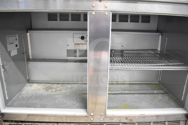 Beverage Air UCR48A commercial 2-door undercounter cooler, interior view; includes wire shelves, labels visible, on casters.