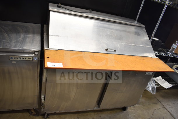 Beverage Air sandwich salad prep table, stainless steel, mega top, on commercial casters. 115V, 1 phase. Fair condition.