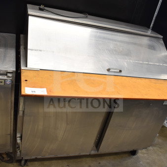 Beverage Air sandwich salad prep table, stainless steel, mega top, on commercial casters. 115V, 1 phase. Fair condition.