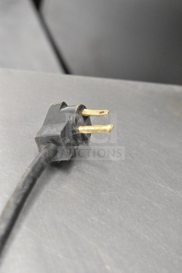 Beverage Air commercial sandwich salad prep table plug on stainless steel surface, 115 volts, 1 phase.