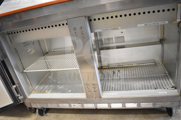 Beverage Air commercial sandwich salad prep table with Bain Marie mega top on casters. Features shelving and visible labels.