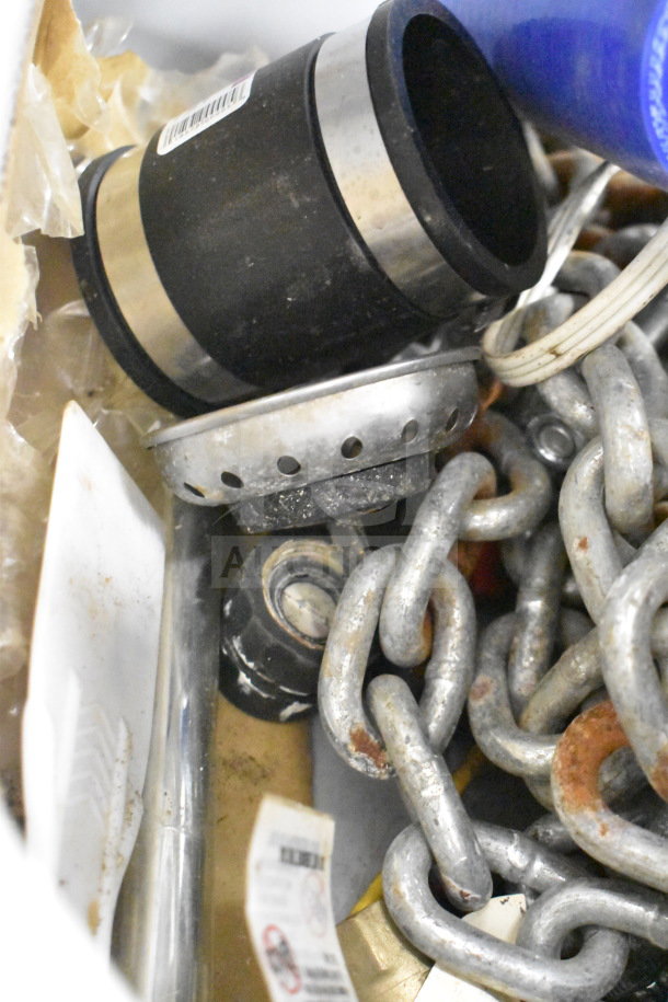 Lot of various items including metal chain, black basin stopper, and metal bin. Mixed condition, ideal for utility use.