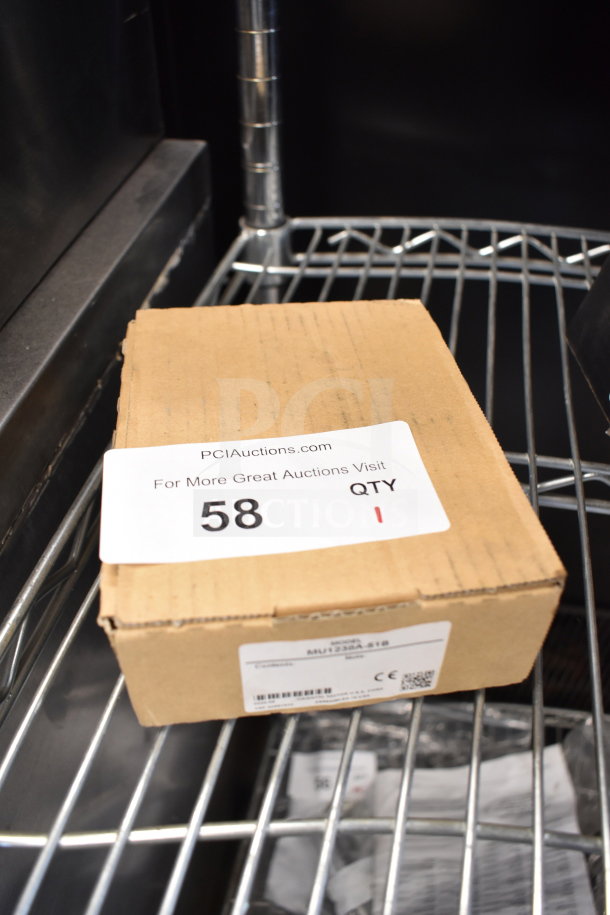 Cardboard box containing MU1238A-51B 4.69 in. axial fan. Visible label with item code. Unopened and in original packaging.