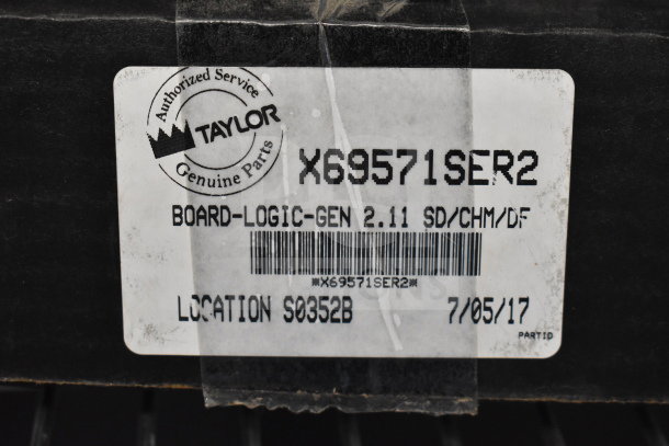 Taylor X69571SER2 logic board in packaging, marked "Authorized Service Genuine Parts," model 2.11, labeled 7/05/17.