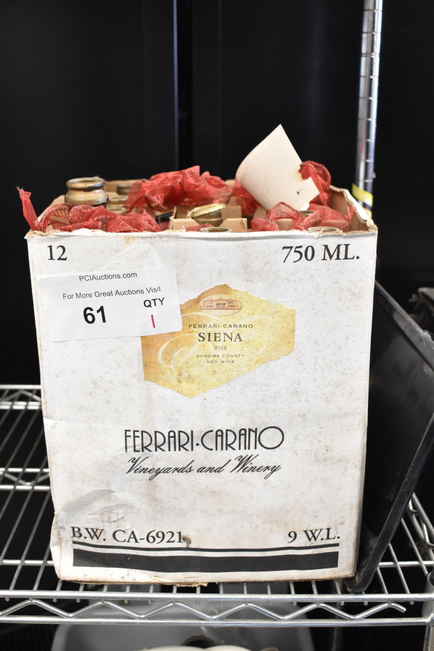 Box of 12 Ferrari-Carano Siena 2012 wine bottles, 750ml each. Includes winery branding, damaged box. Auction tag visible.