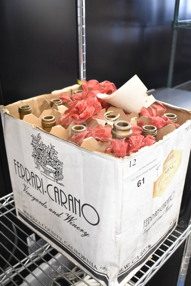 Box of 12 Ferrari-Carano bottles in protective packaging, visible winery logo, some wear on box edges.