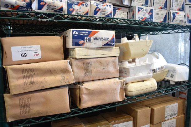 14 new but scratch and dent items including Lithonia Lighting LED exit signs with battery, various boxed conditions.