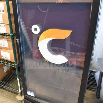 IDW GCG-10-F2334B single door reach-in cooler merchandiser, branded "Celsius Live Fit," 110-120 Volts, visible shelving.