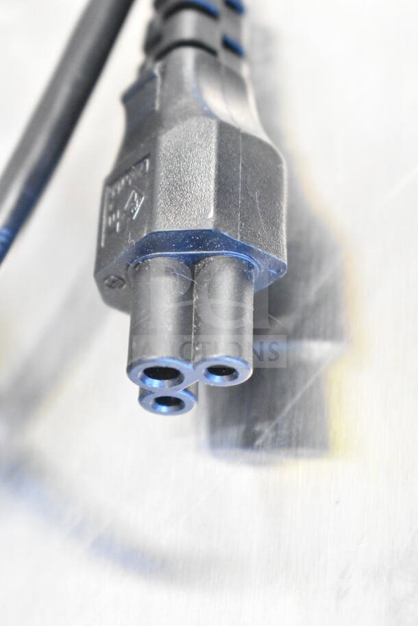 Power cable for TSC TC210 Thermal Transfer Label Printer in good condition, close-up detail showing connector pins.
