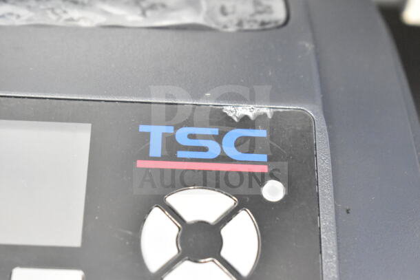 TSC TC210 Thermal Transfer Label Printer with visible logo, minor wear near control panel, emphasizing brand authenticity.