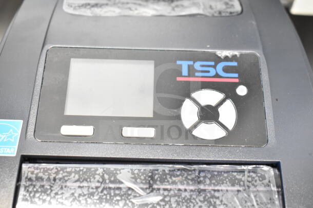 TSC TC210 Thermal Transfer Label Printer, black, clear display, directional control pad, minimal wear visible.