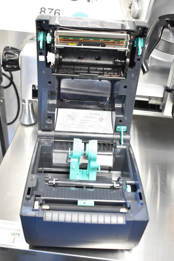 TSC TC210 Thermal Transfer Label Printer, open view, showing mint condition internal components and loading mechanism.