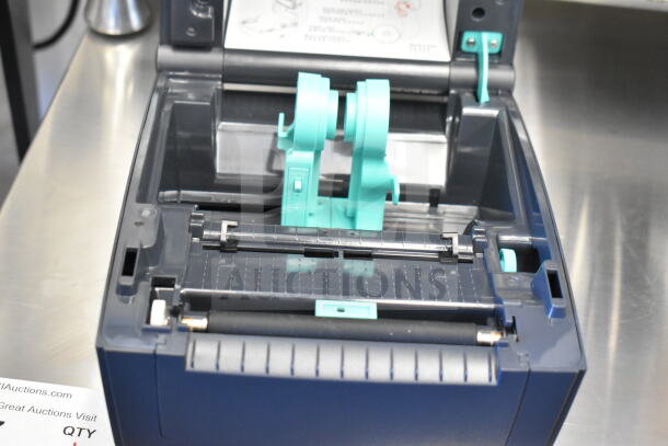 TSC TC210 thermal transfer label printer, open view showing internal components, excellent condition, TSC branding visible.