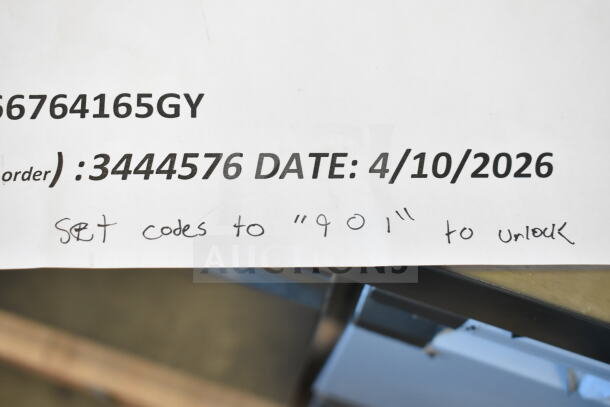 BRAND NEW scratch and dent metal locker, four-tier, one wide, 6 feet high, 15 inches deep, gray, assembled. Visible code note for locking mechanism.