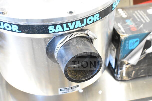 Brand new Salvajor 200 commercial garbage disposer, 208V, 1 phase, 2 hp. Minor scratches visible. Model label intact.