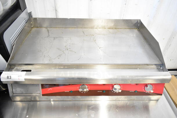 Brand new Avantco 177EG30N 30" electric countertop griddle with scratches and dents. 208/240 volts. Three control knobs.