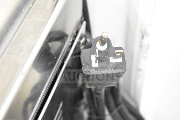 Close-up of the power plug on an Avantco 177EG30N 30" electric countertop griddle, 208/240 volts.