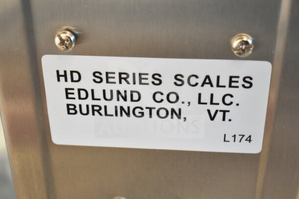 "Edlund HD-2 Heavy Duty 32 oz. Portion Scale, brand new with scratches, label displaying manufacturer details."