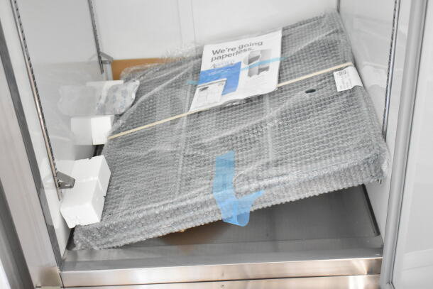 Brand new Avantco 178A23FHC commercial single door freezer, 115V, packaged with protective materials, minor scratches.
