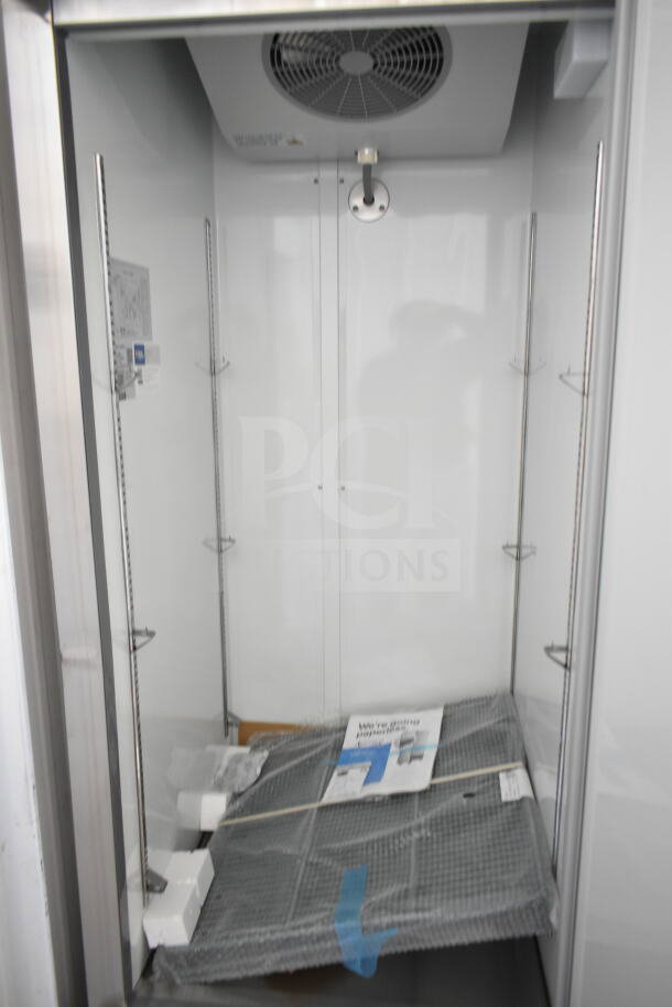 Brand new Avantco 178A23FHC commercial freezer, single door, 115V, scratch and dent, with internal shelving and manual.