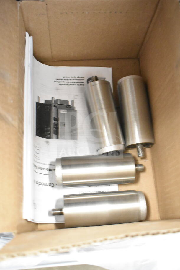 Box containing parts for Cleveland 22CCT6 SteamChef steamer. Includes cylindrical components and manuals.