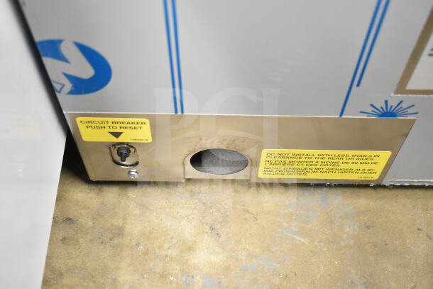 Brand new Cleveland 22CCT6 SteamChef steamer base, showing safety labels and circuit breaker switch.