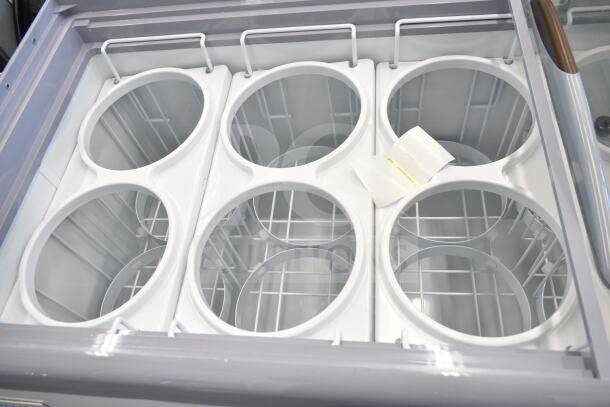 Brand new Avantco 360ADC12N 71" ice cream dipping cabinet, scratch and dent, 115V, 1 phase, customizable, empty interior.