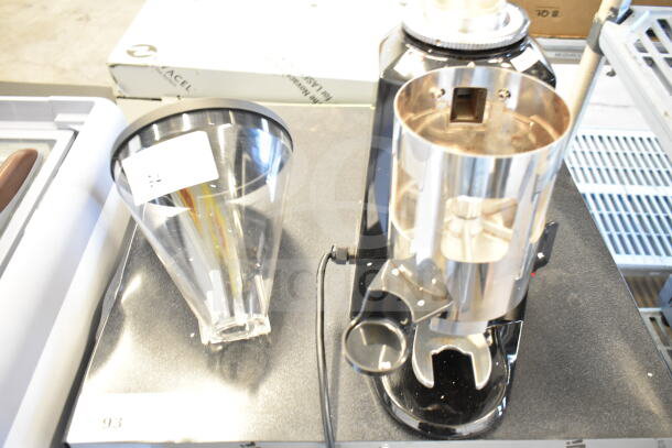 BRAND NEW Estella 236ECEG26 espresso grinder, 120V, 1-phase. Notable scratch and dent; broken hopper visible.