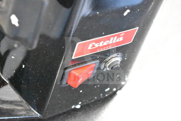 BRAND NEW Estella 236ECEG26 countertop espresso bean grinder, 120V, 1 phase. Visible scratches and broken hopper.