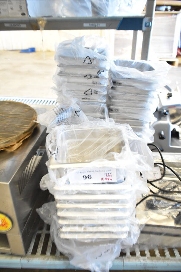 Stack of 48 new stainless steel drop-in bins, Choice brand, 1/6 size, 4" and 6" deep, anti-jam feature, in packaging.