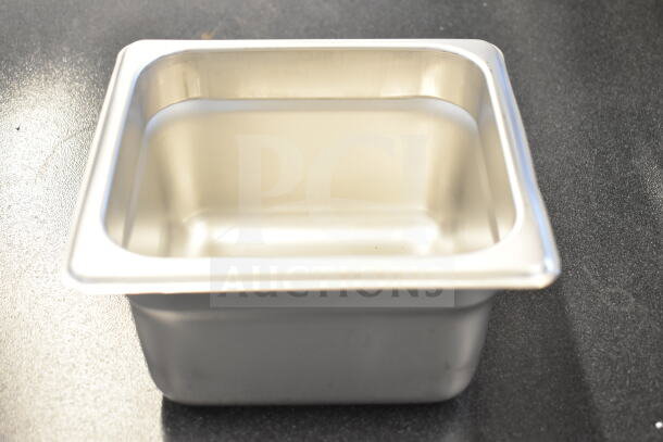 Auction item: New stainless steel drop-in bin, anti-jam, 1/6 size, 4" deep. Perfect for steam tables and hotel pans.