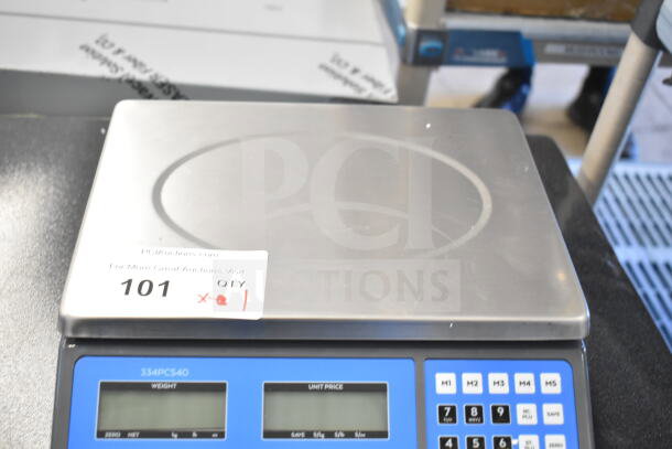 Brand new AvaTek 334PCS40 digital price computing scale, 40 lb. capacity, minor scratches, model label, auction tag visible.