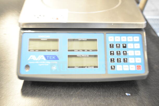 Brand new AvaTek 334PCS40 digital scale, 40 lb capacity, scratch and dent condition, with digital display and keypad.