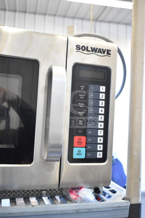 Brand new Solwave 180MW2100TH commercial microwave, 2,100W, 1.2 cu. ft. interior, scratch and dent, push button controls.