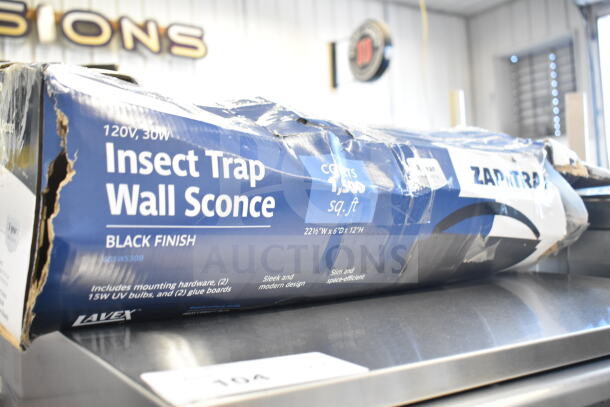 Brand new Lavex 605WS30B Zap N Trap Black Wall Sconce Insect Trap, covers 1,500 sq. ft., 120V, slight box damage visible.