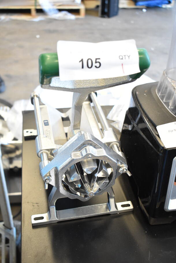 Countertop Vegetable Wedge Cutter, brand new with minor scratches, metal construction, green handle, auction tag number 105.