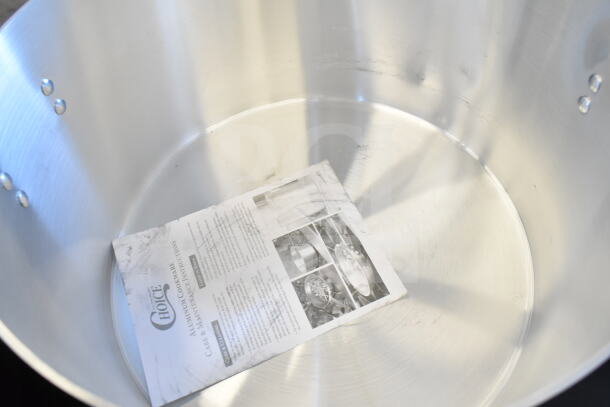 BRAND NEW Choice 471SAP60QT 60 Qt. Aluminum Sauce Pot with visible care instructions booklet inside, minimal surface marks.