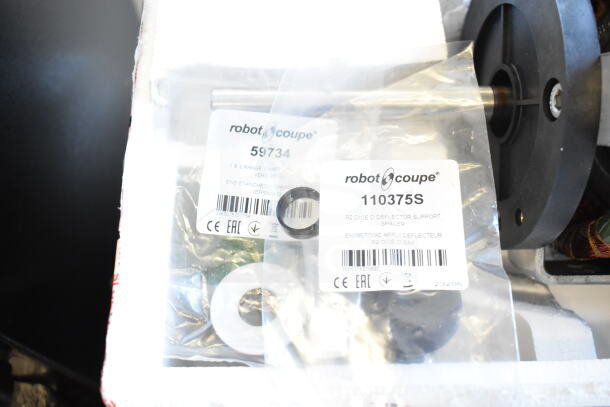 BRAND NEW SCRATCH AND DENT Nidec Motor, 120 Volts, 1 Phase, shown with packaging and Robot Coupe labels indicating model numbers.