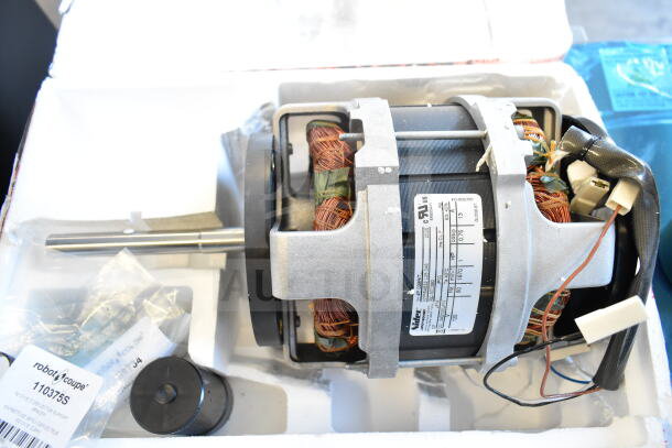 Brand new Nidec motor, 120V, 1 phase, slight scratches, visible label details. Includes accessories and original packaging.