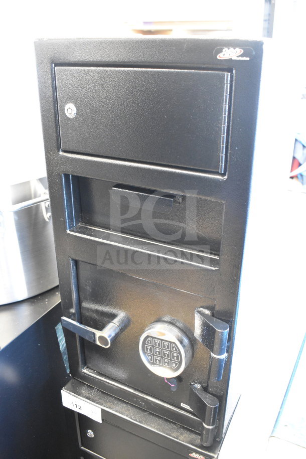 Black steel depository safe by 360 Office Furniture, 14" x 14" x 27.25", with electronic keypad and top locker. New, scratch and dent condition.