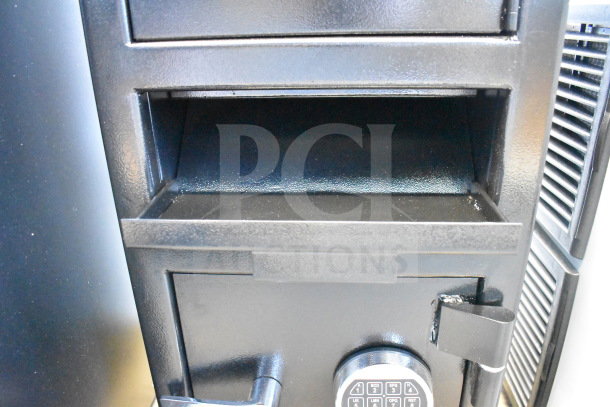Black steel depository safe, 14"x14"x27.25", electronic keypad, independent top locker, minor scratches.