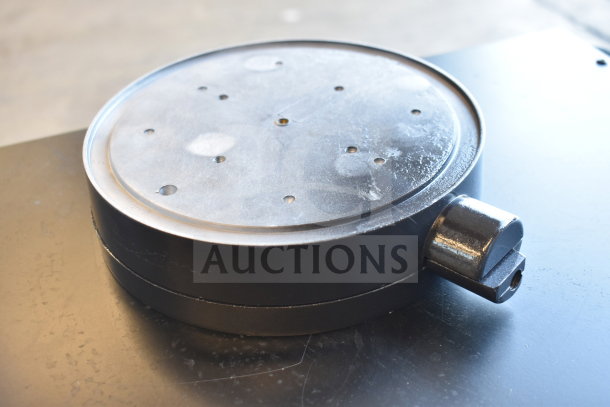 Round metal component with several holes on top, part of a group of six scratch and dent auction items.