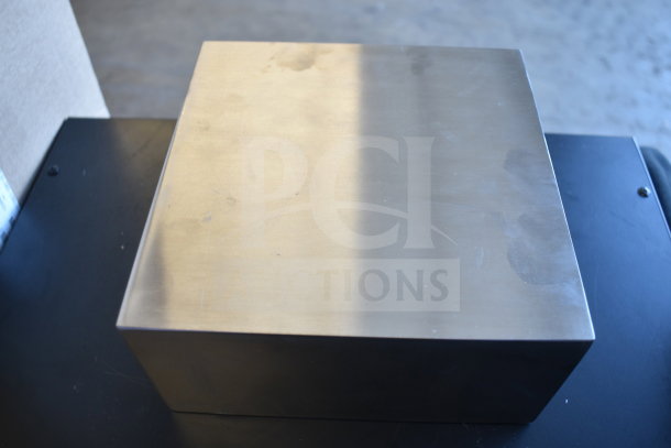 Stainless steel rectangular riser, 8"x8"x4", American Metalcraft, new condition, minor surface marks.
