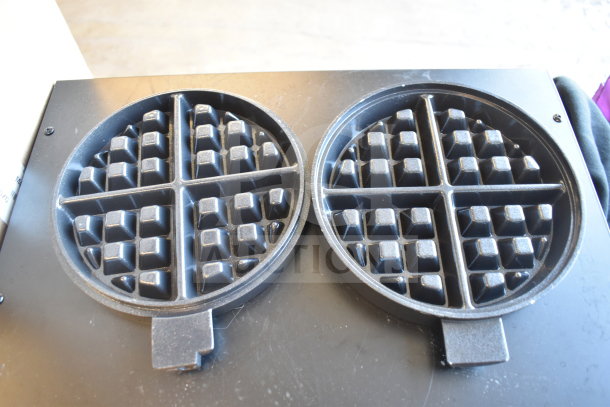 Two Carnival King 382PWBMG3 waffle grids, new condition, featuring non-stick surface and circular design.