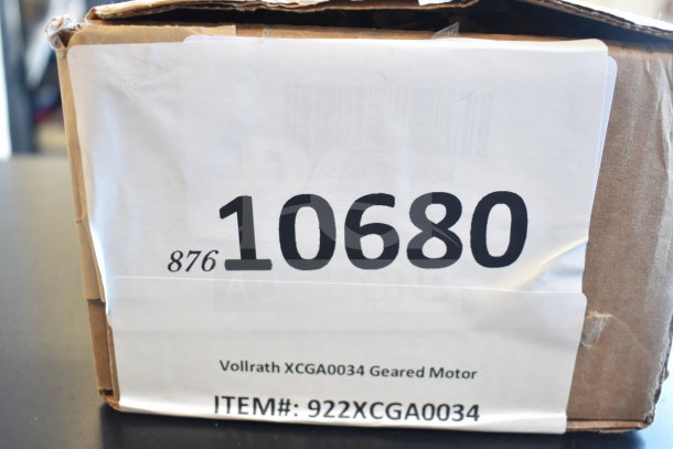 Cardboard box labeled Vollrath XCGA0034 Geared Motor, item #: 922XCGA0034, new scratch and dent condition.