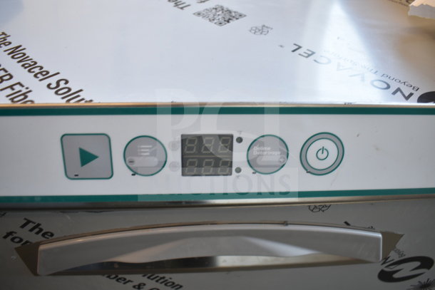 Brand new Noble 495LTUC24 low-temp undercounter dishwasher, control panel shown, 120V, minor scratches, model tag visible.